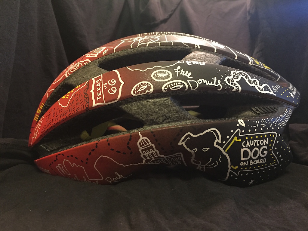 Custom helmet with art chronicling riders cross country bike tour. Instagram of the tour at @9mph_
