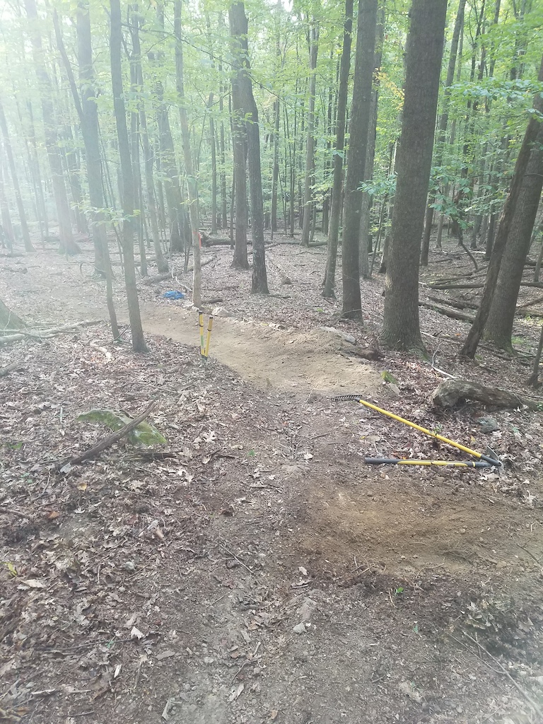 Berm/bench right before crossing rocky trail.  Looking down trail at the entrance. waterbar installed before entering the turn for drainage.