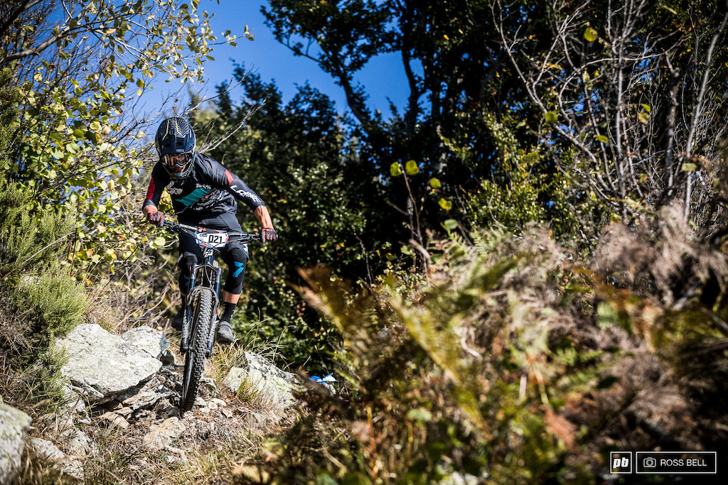Adrien Dailly hunting for lines as one of the first riders down the hill this morning, pushing up three times to perfect this one section.