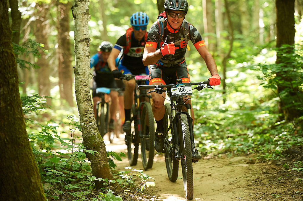 Stoked riders at Vallée Bras-du-Nord during the Quebec Singletrack Experience.