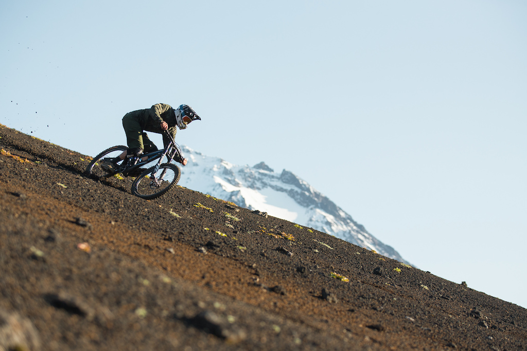Drawing first lines in the vulcano dirt. Must be a weird scenery for our russian guide, six germans in the Siberias´ wilderness seeking for some gravel slopes to ride down with a bike. Photo Constantin Fiene