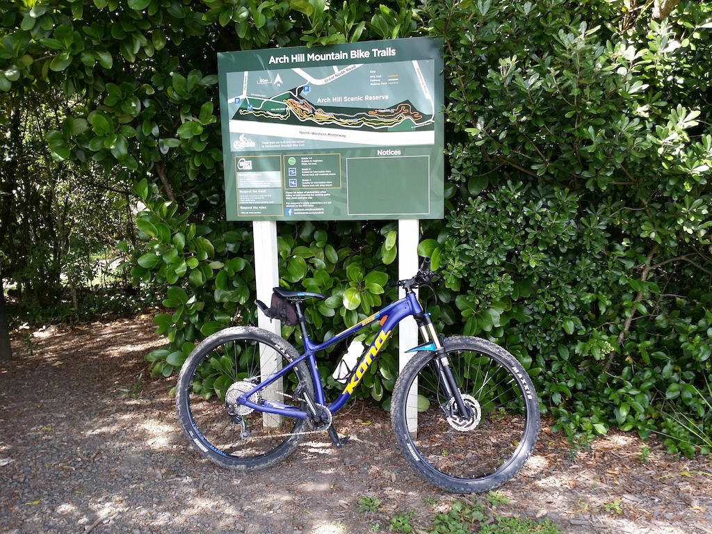 Bike in front of trail information board