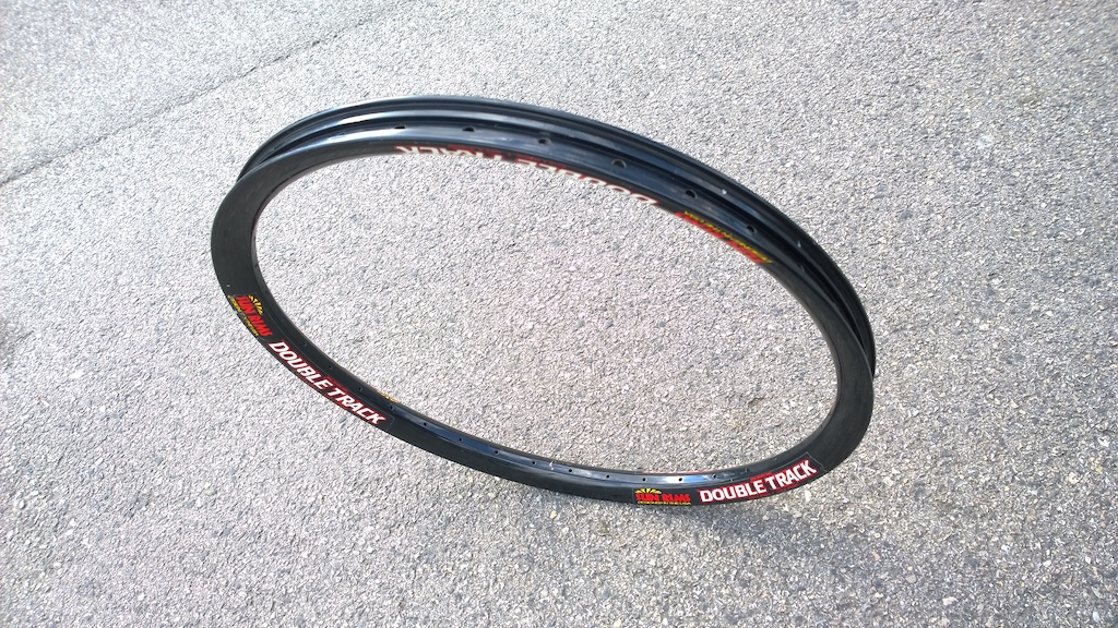 Has anyone seen a rim like this? Its a Double Track, but very unusual, it has high gloss paint rather than the usual matte, no steel nipple rivets and the inside has a simmilar pattern to the Double Wide. Could this be a prototype or an early showcase? could not find a single clue on the net.