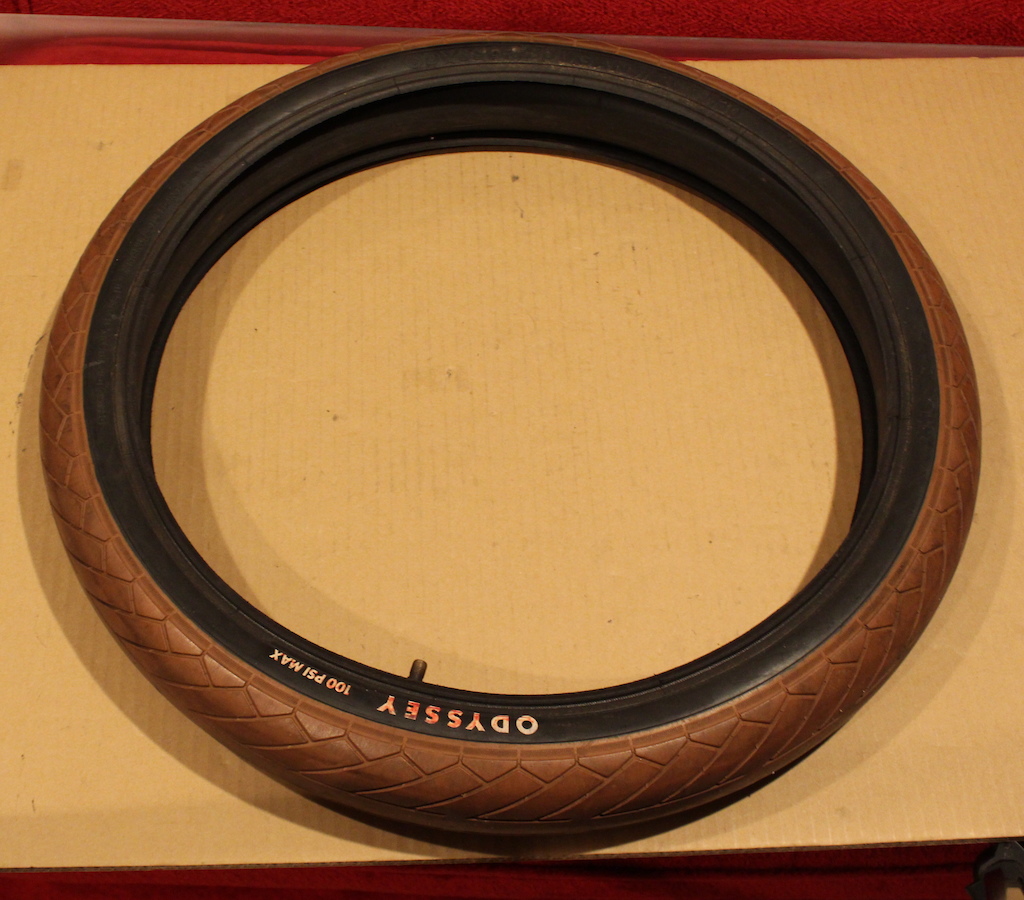 $25 - Odyssey Dugan 20x2.30 Tire, brown with black side wall, 75% tread