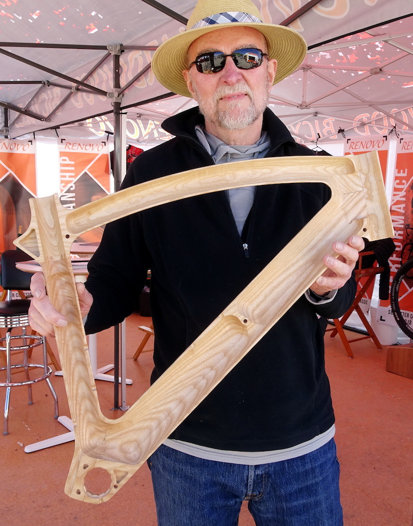 Ken Wheeler Renovo founder holds one of the matching halves of a front triangle.