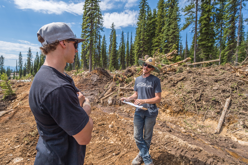 Tom and Alex from LOFT Bike Parks walk the course to get the lay of the land and plan out jumps and features