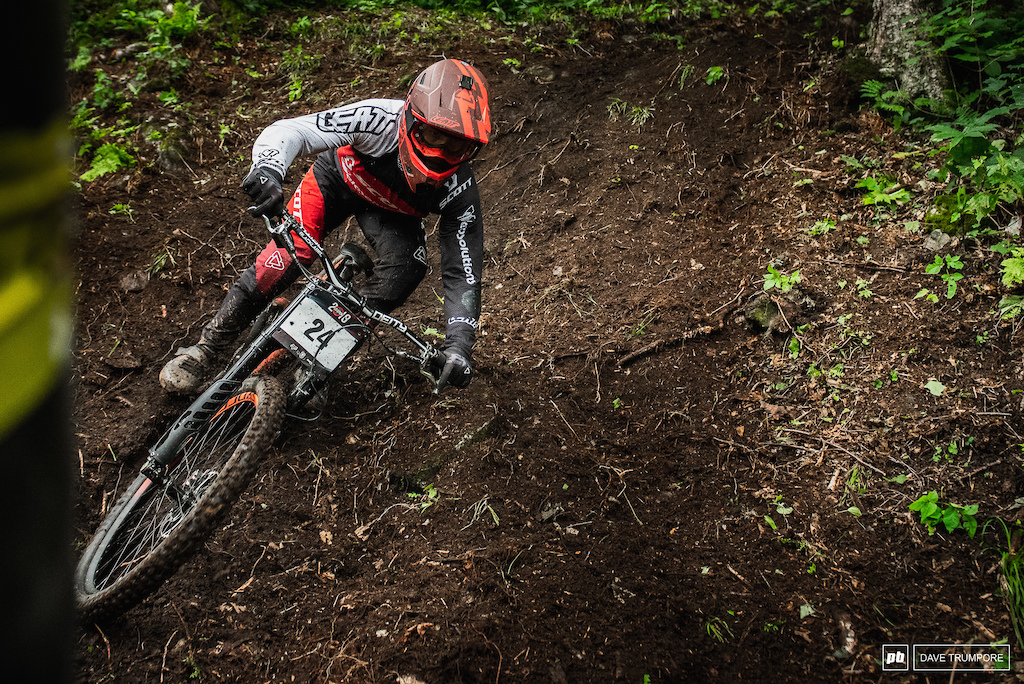 French national champ Gaetan Vige tries to keep his bars out of the loam while railing one of the bigger ruts that has formed in the bottom woods.