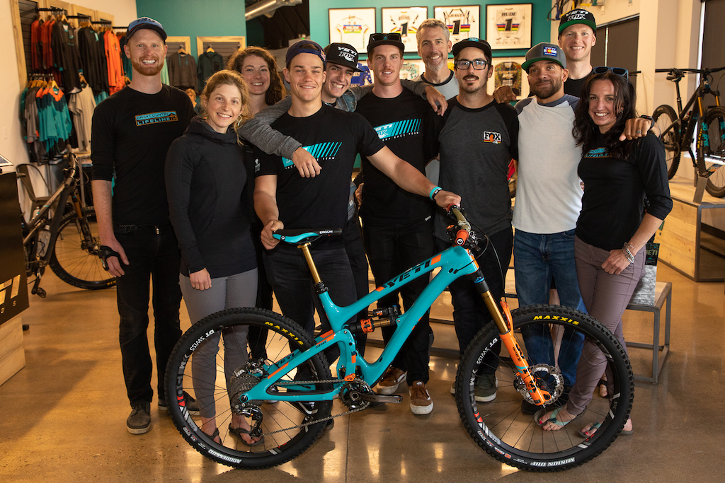 Factory Team, Leadership team, and Chris Conroy show off the GiveAway Bike.
