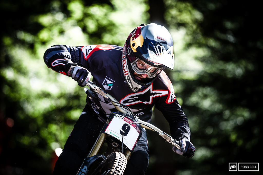 The unmistakable glare of Aaron Gwin scopes out the rocky drops on the exit of the forest.