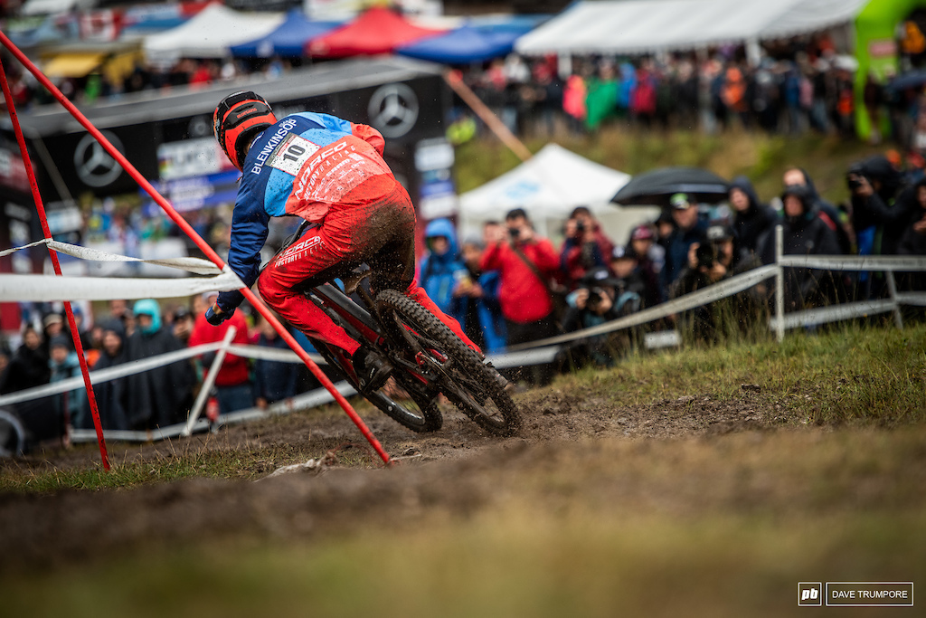 Foot up and committed, Sam Blenkinsop heads around one of the final flat and muddy grass corners.