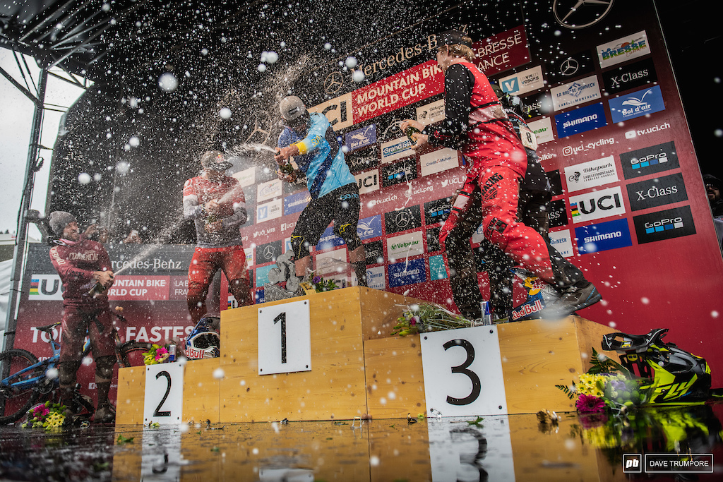 The hardest rain of the day fell on Martin Maes in the form of champagne from atop the podium.