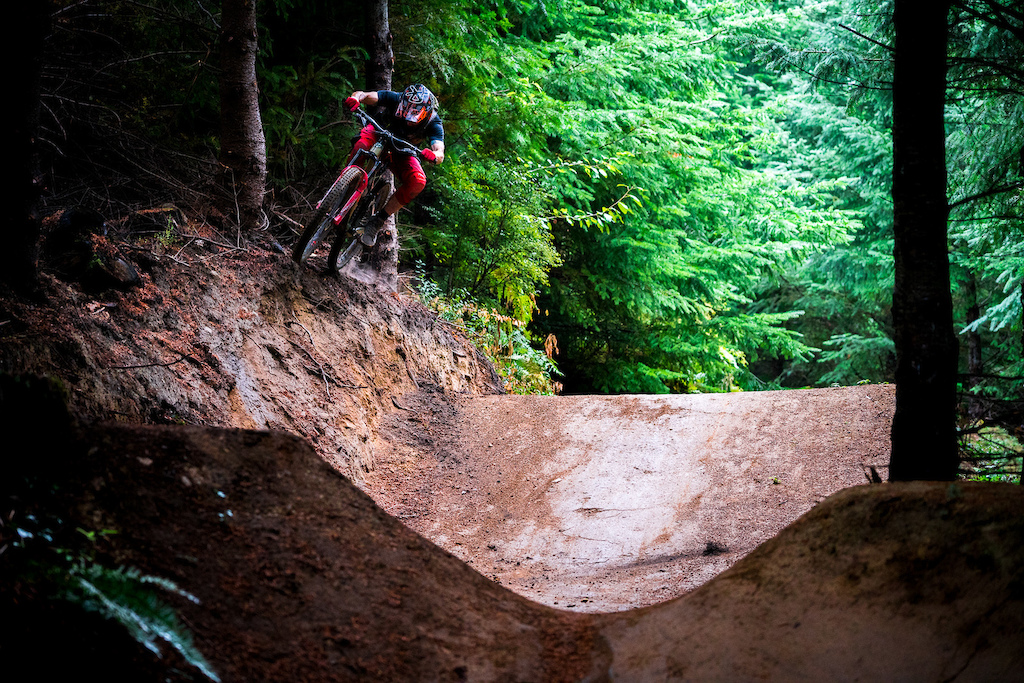 Kirt Voreis airs to a bank on his mountain bike at Galbraith Mountain near Bellingham, Washington.