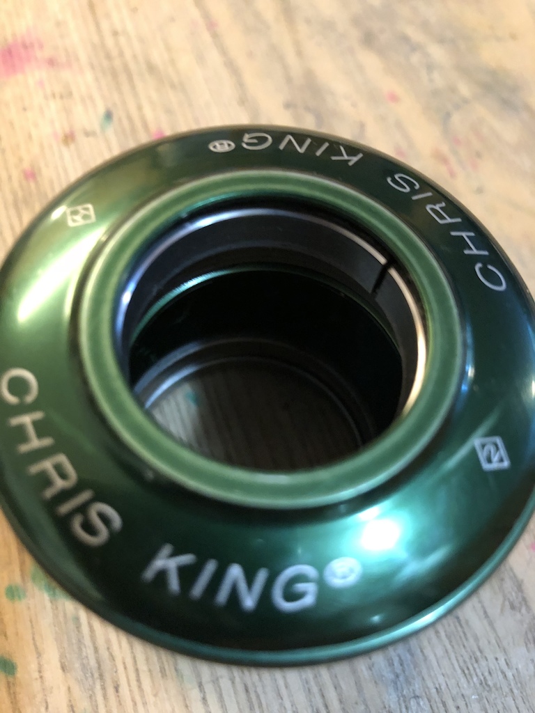 Here is a chris king inset headset. 
It’s green. 
It’s been in a couple bikes. 
It’s still in great shape. 
Minor scuffs on the out side and a few removal knicks on the inside. Works rad.