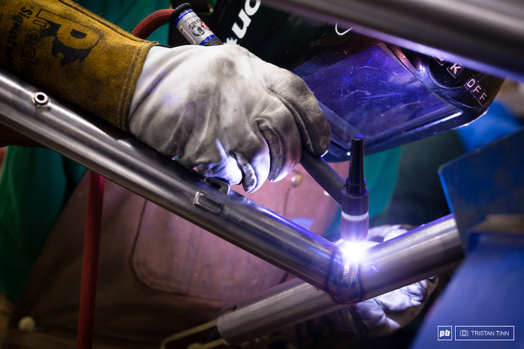 The seat tube - top tube junction is welded before the top linkage mount can be positioned.
