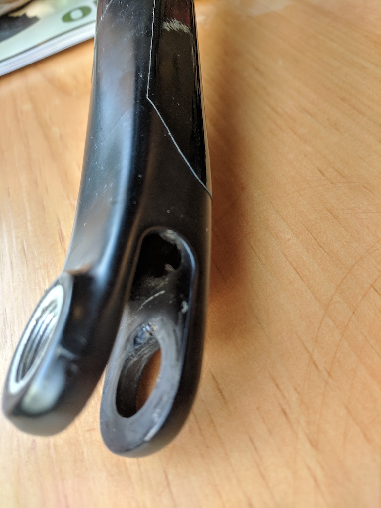 I also noticed a bit of wear on the rocker stay at the Seatstay Pivot axle is inserted.  Opposite the chain ring side, the bearing spacer is digging into the carbon and gauging a small groove.  The bearing here seems like it is seated correctly, and it spins smoothly.  Wear is minor, but I am worried that it could get worse.  Is this a warranty issue?