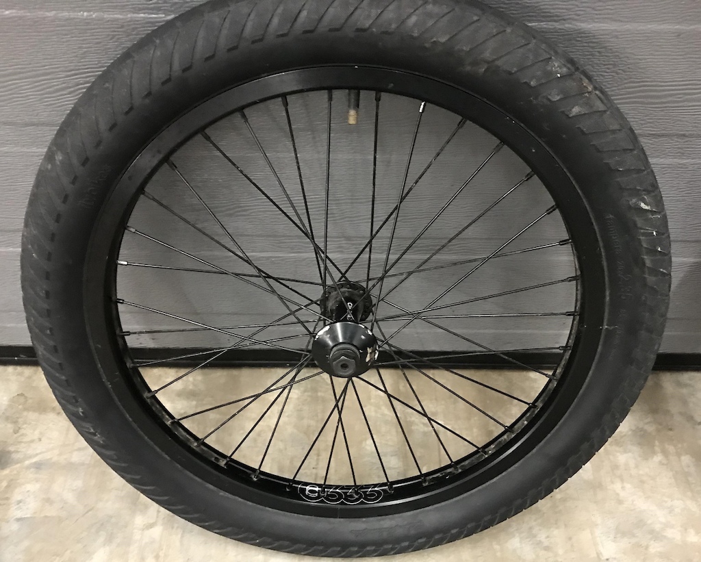 $60 - Cinema ZX front wheel, 333 rim, comes with tire and 1 hub guard.