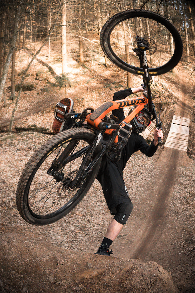 Foot plant on durt jump kick with DH bike.
