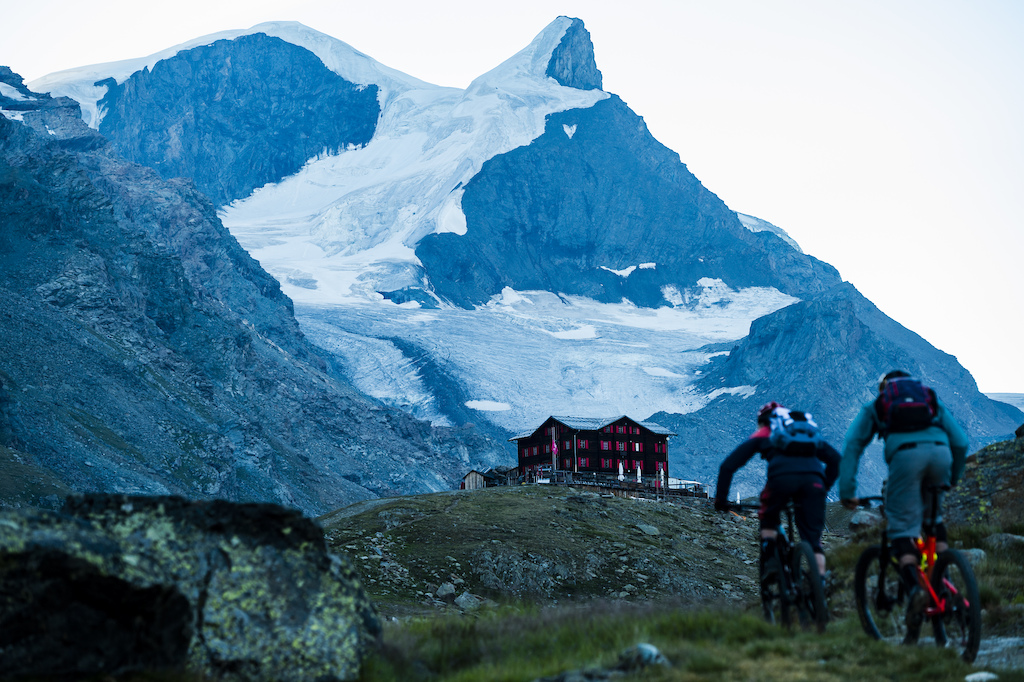 Julia Hofmann and Stephen Matthews riding near Fluhalp Hut, 2620 meters above sea level above Zermatt, Switzerland. Photo Mattias Fredriksson.