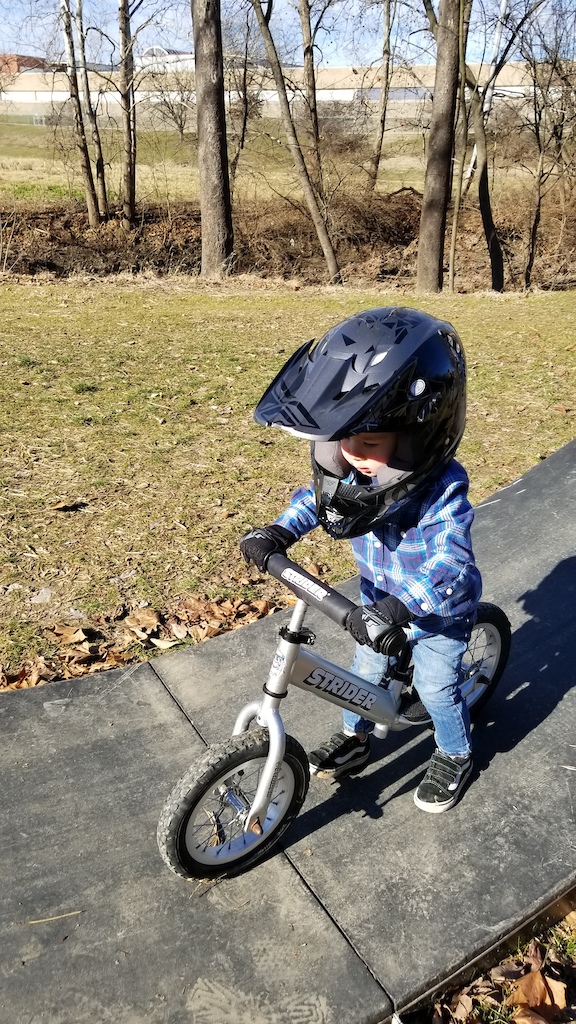 This is my little guy, strider at 18 months. Pedal bike, no training wheels, hand brake at 2.5 years. He's Rad!