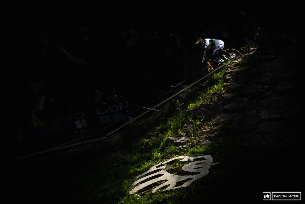 Loic Bruni through a sliver of light coign does into the finish area.
