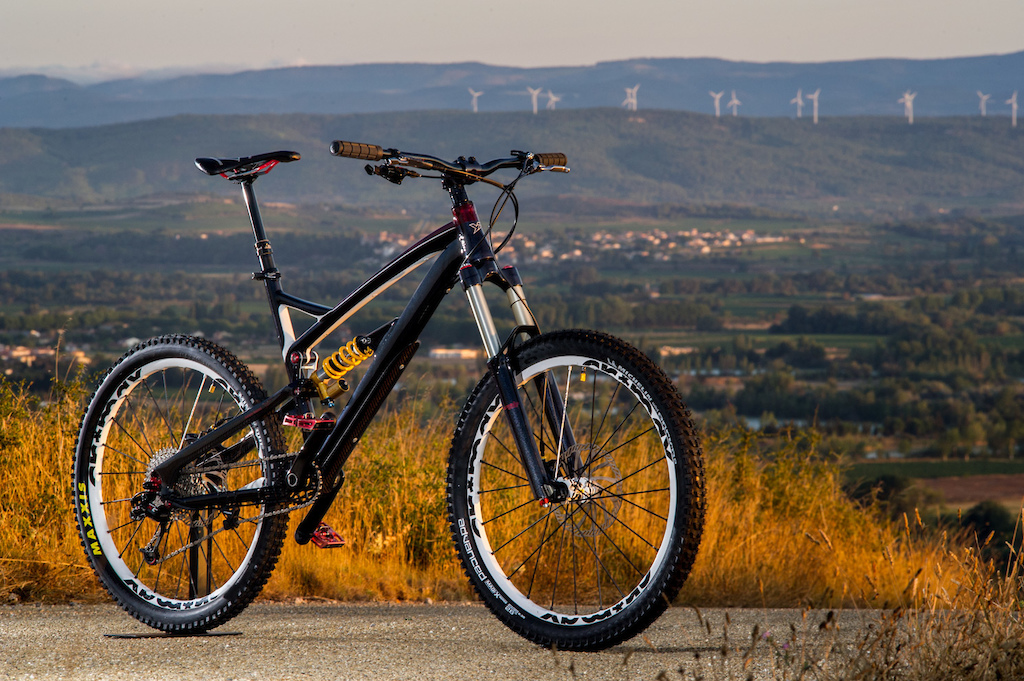 Sunrise on a YT Industries custom paintjob - windmill and Montagne Noire background