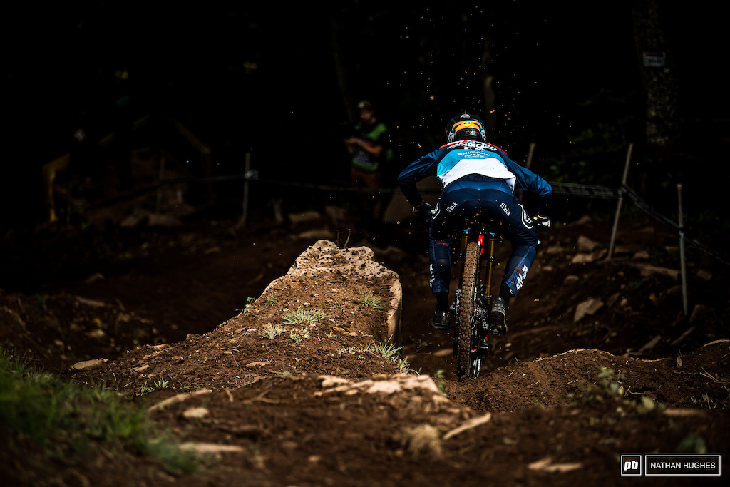 6th place Luca Shaw flinging the drying dirt as he heads into the depths of the middle woods.