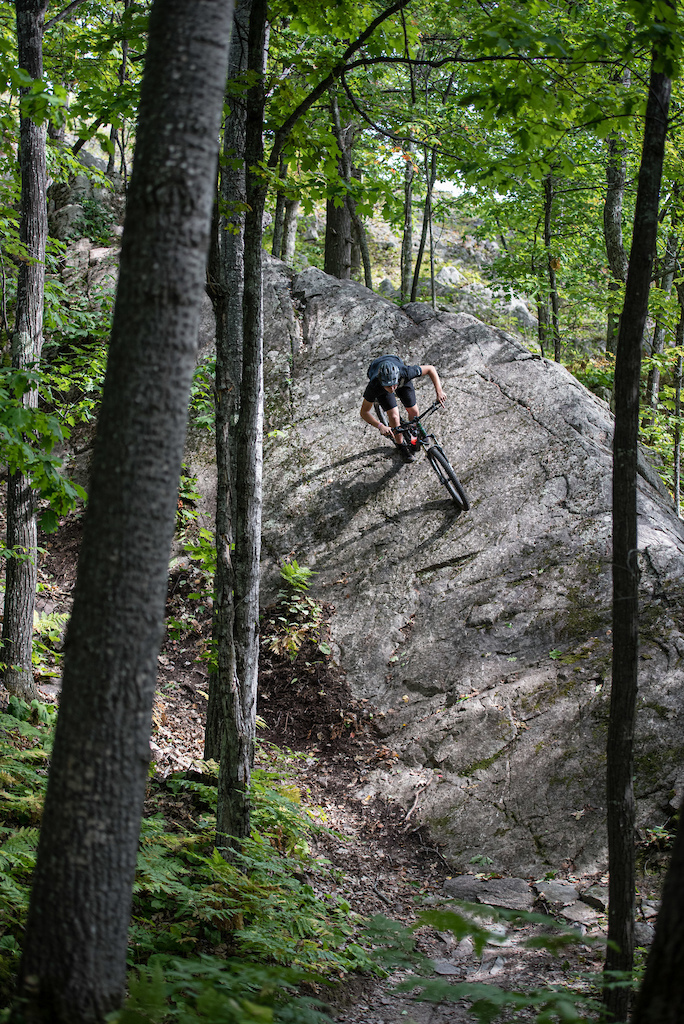Max hitting the big rock roll off Top Of The World on Doc Nobbs in Marquette, Michigan. bryanmitchell.com