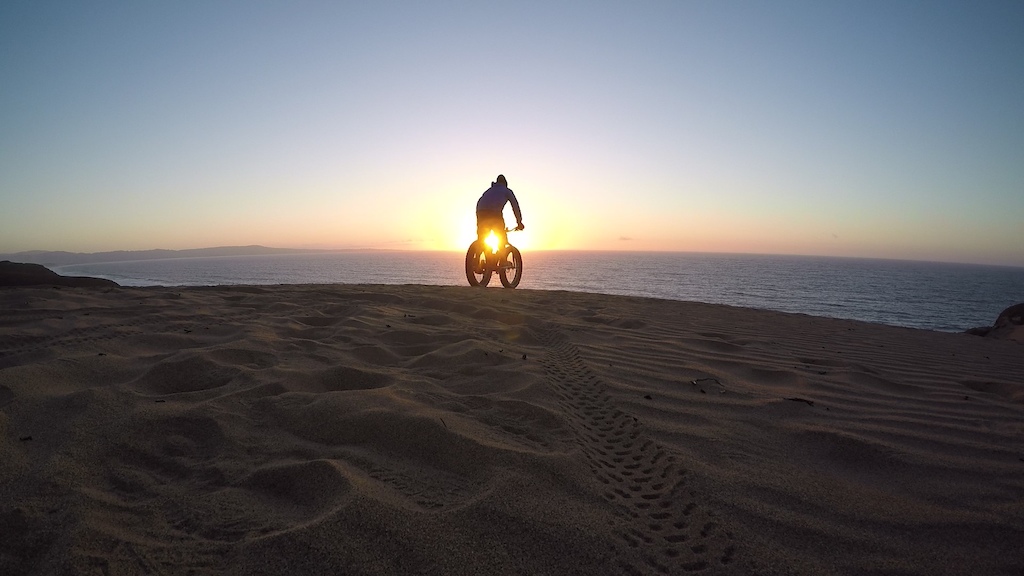 Sand biking at sunset at Marina Dunes, CA Monterey Bay. Specialized 2014 Fat Boy