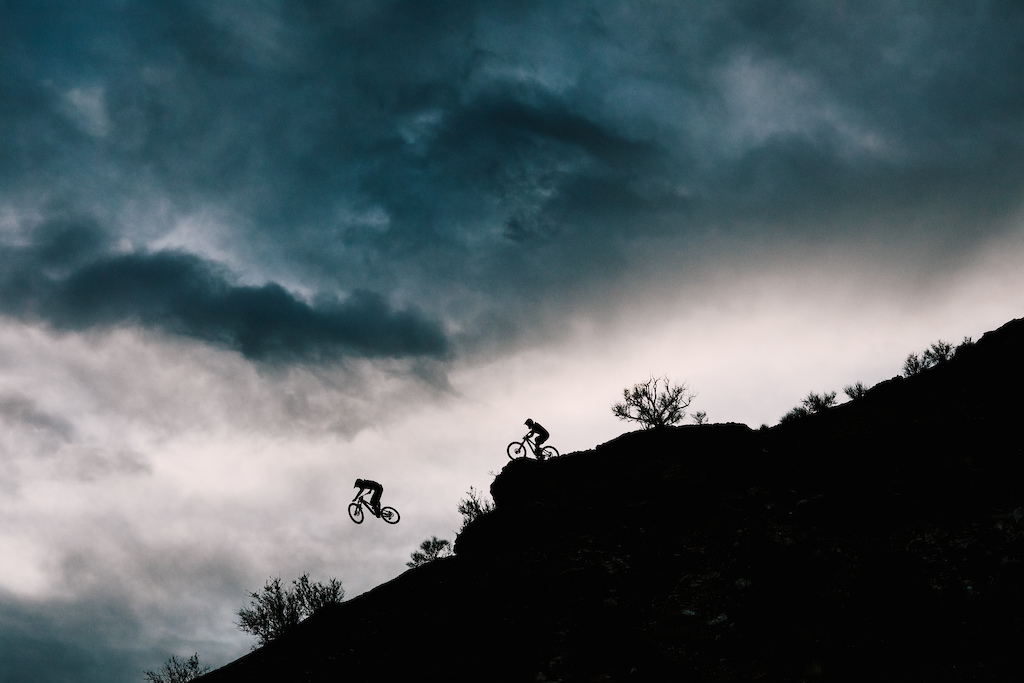 The McCaul brothers session a ridge as a storm rolls in.