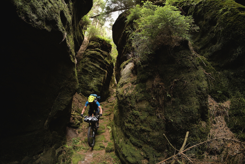 The Green Gorge -  Matze riding down a narrow path in the sandstone on the last of three days of bikepacking in Lužické hory and Labské pískovce.