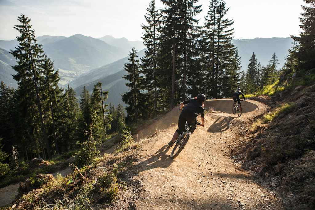 Vali Höll and Angie Hohenwarter taking the first official laps on the new section of Panorama Trail in Saalbach.