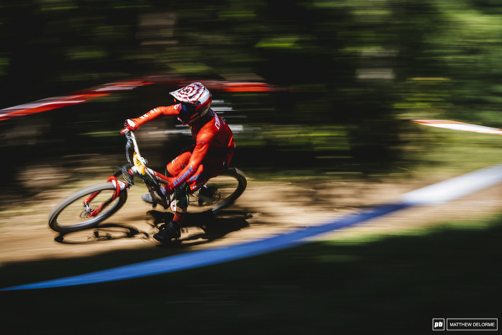 Antoine Vidal speeds through the forest in Val Di Fassa, Italy