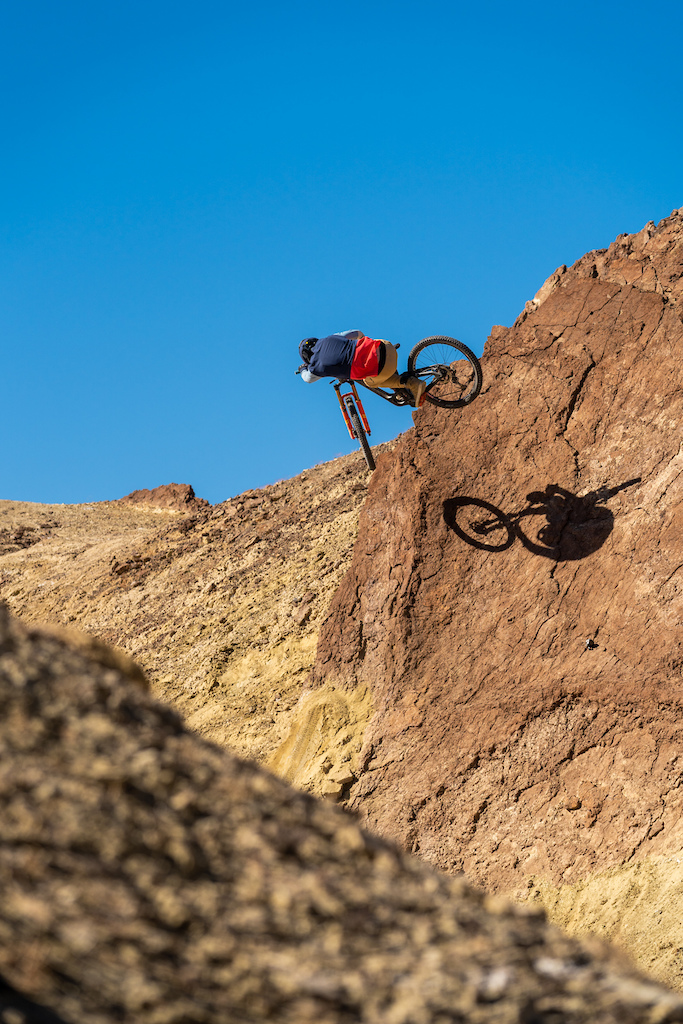 Kirt Voreis launches an inward table on a rock quarterpipe in the California desert.