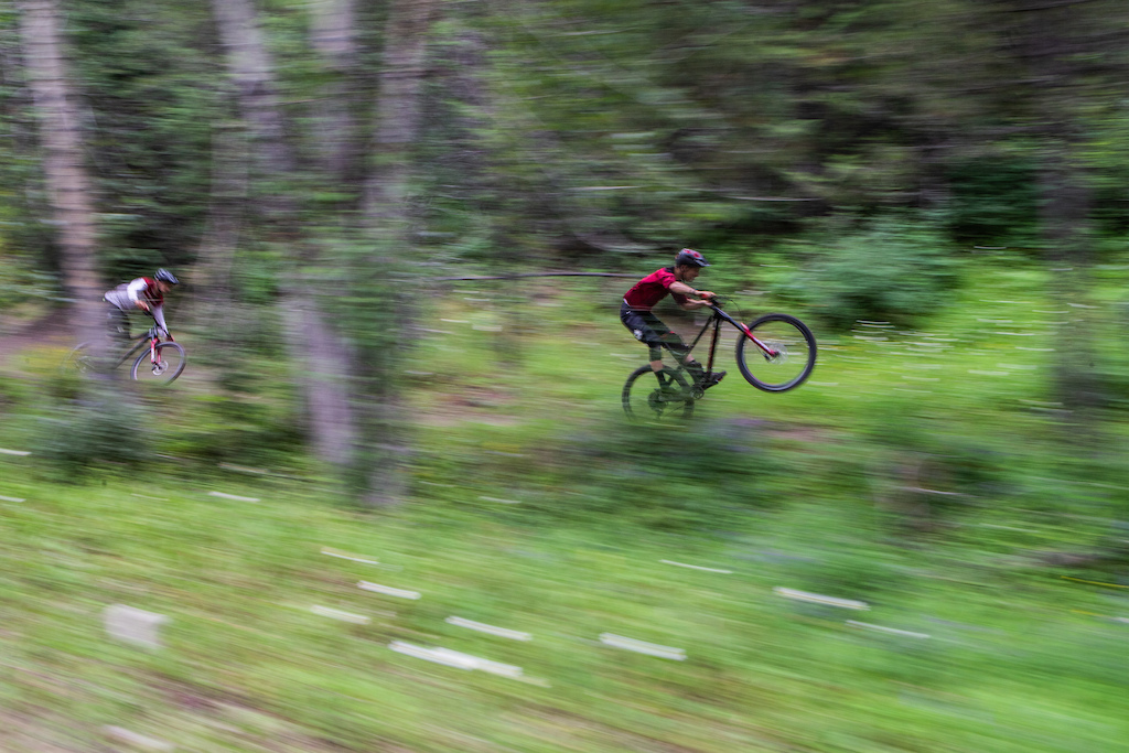 Sam Blenkinsop popping a manual in Fernie with Henry Fitzgerald chasing him down