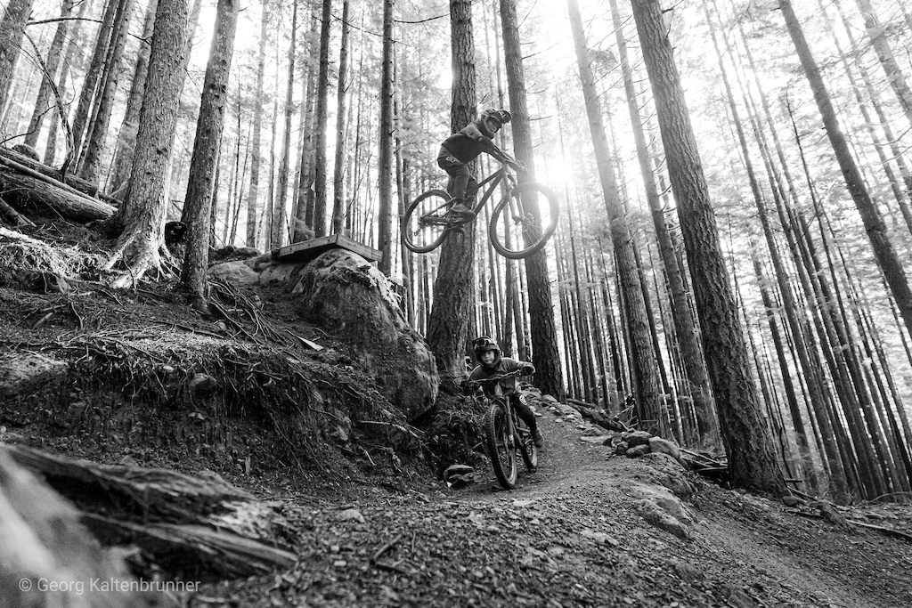My sons, Tristan 10 airing over Adrian 8 on one of Squamish most popular new trails.