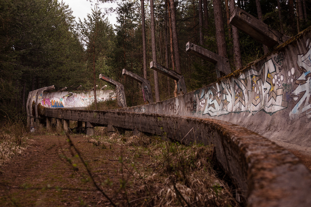 Selfportrait Racing down the Bobsled Track close to Sarajevo that was build for the Olympic games in 1984. It was partly destroyed during the Siege of Sarajevo and you can still find Holes in the track. printed in mtbrider magazine 2019