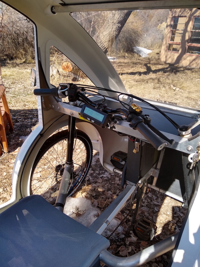 Organic Transit 2 seat Solar E-Trike represents a cross between a car and a bike