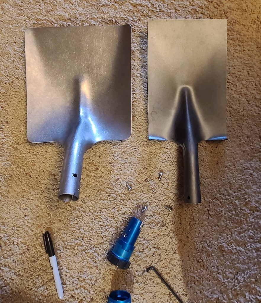 Trail boss tool mods:

Old stock flat shovel (right) that is useless for packing dirt due to a flat shovel neck: 835g

New titanium shovel from Russia (left) via Ebay which is shaped much better for packing dirt: 550g.