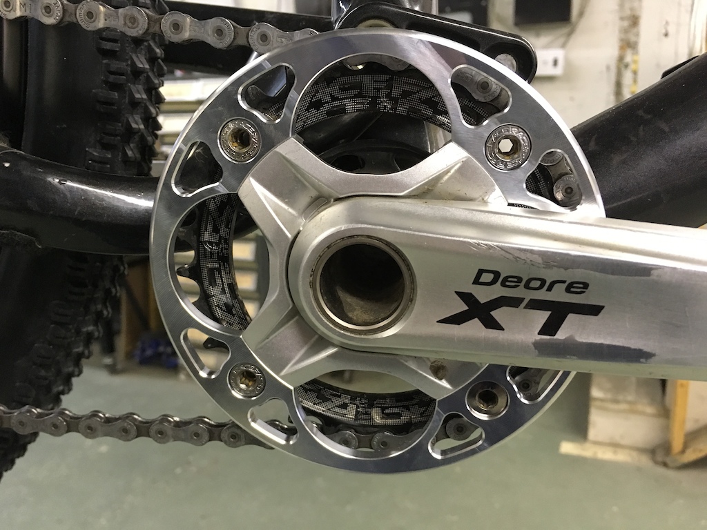 Custom made bash guard/chain guide for a 2008 XT crank with a 30 tooth narrow wide ring.