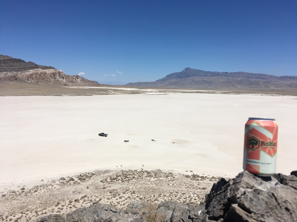 Tule Valley/Ibex Hardpan.  Its surface is smoother than El Mirage dry lake.  The pointy peak in the distance is Notch Peak, the second tallest cliff in Merica. Beer: Grapefruit IPA by RoHa Brewing Project of SLC