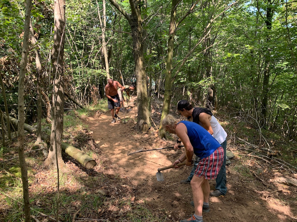 The team working on the upper section of the trail on one of the hottest days of the year.