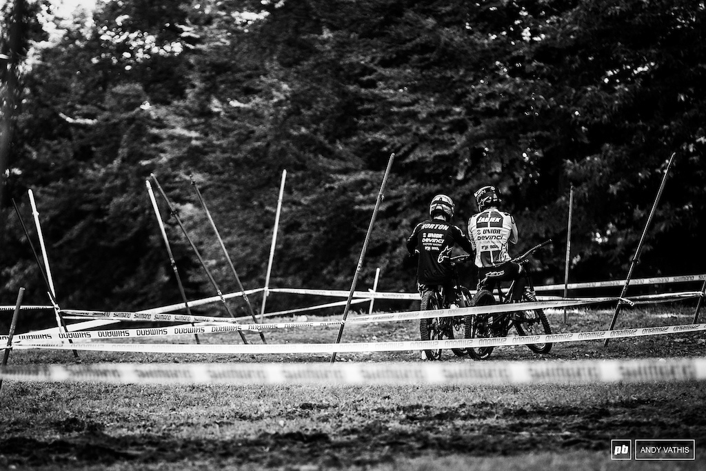 The Devinci boys discussing line variations before dropping into the bottom of the course.
