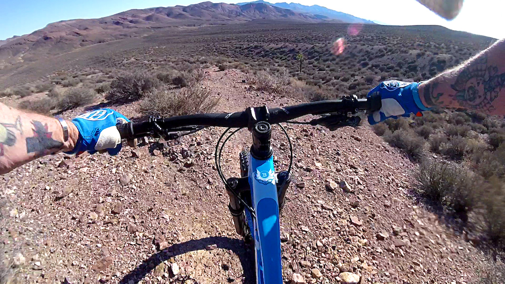 Beginning the descent on "Brad's Screamer" Beatty Wash below in the distance.