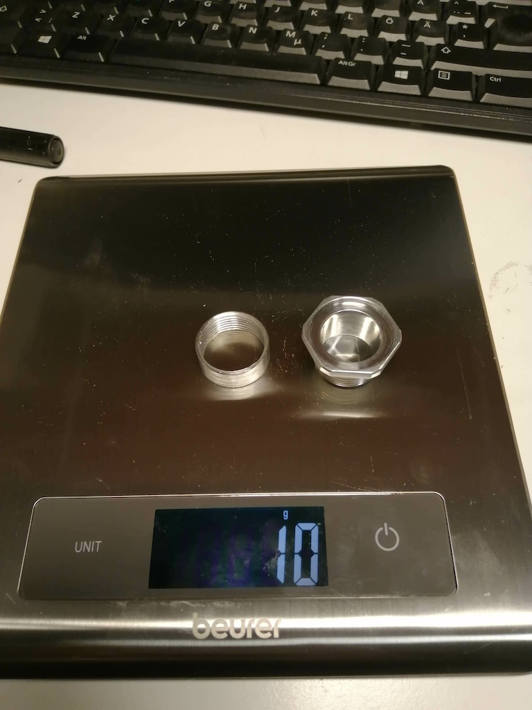 Homemade "star nut". First use of my new lathe. Made primarily so I could route the front brake tube through the steerer, but it also saves 15-20 grams compared to a classic star nut.