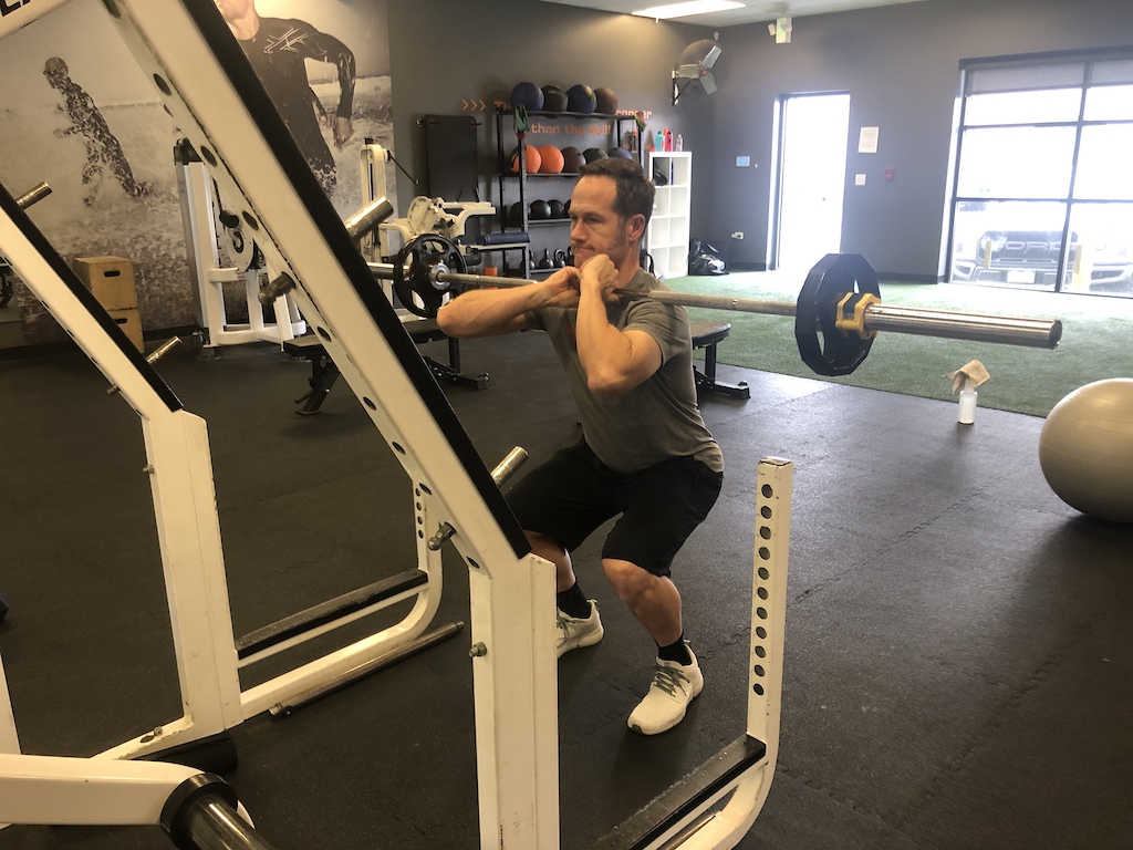 Front squat with a low left elbow b c of recent surgery 