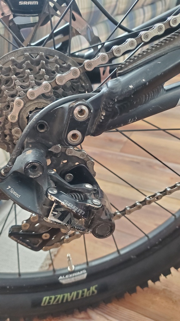 Small paint scuffs near axel & the black on the derailleur arm is worn on the edge.