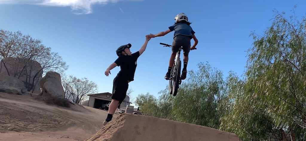 Sick shot of me in the air high fiving, see full shot on my YouTube channel, Dirt Wheels.     Mm