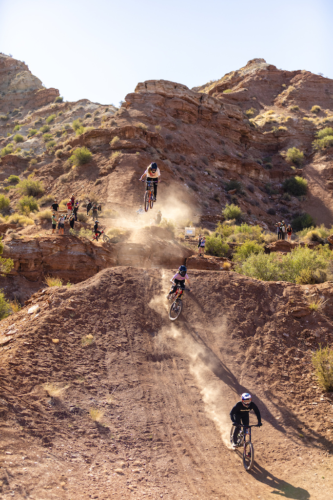 Carson Storch leads Vinny Armstrong and Jess Blewitt off a jump at Red Bull Formation in Virgin, Utah, USA on 27 May, 2021.