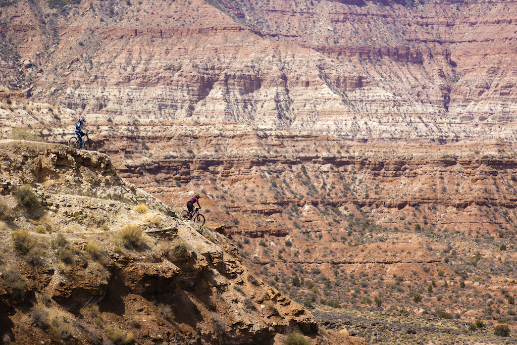 Vaea Verbeeck watches Chelsea Kimball ride a ridgeline at Red Bull Formation in Virgin, Utah, USA on 29 May, 2021.