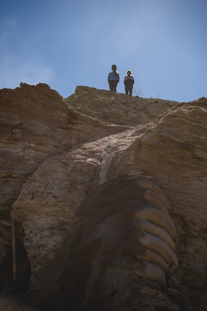 Hannah Bergemann, Casey Brown stand at the top of their line looking down at a feature dubbed "The Ovary" on ride day 2 at Red Bull Formation in Virgin, Utah, USA on 30 May, 2021